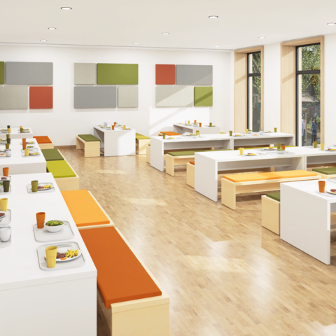 Schulmensa mit großen Gruppentischen mit Sitzbänken und Akustikelementen an den Wänden